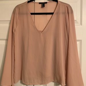 Light pink long sleeve top.